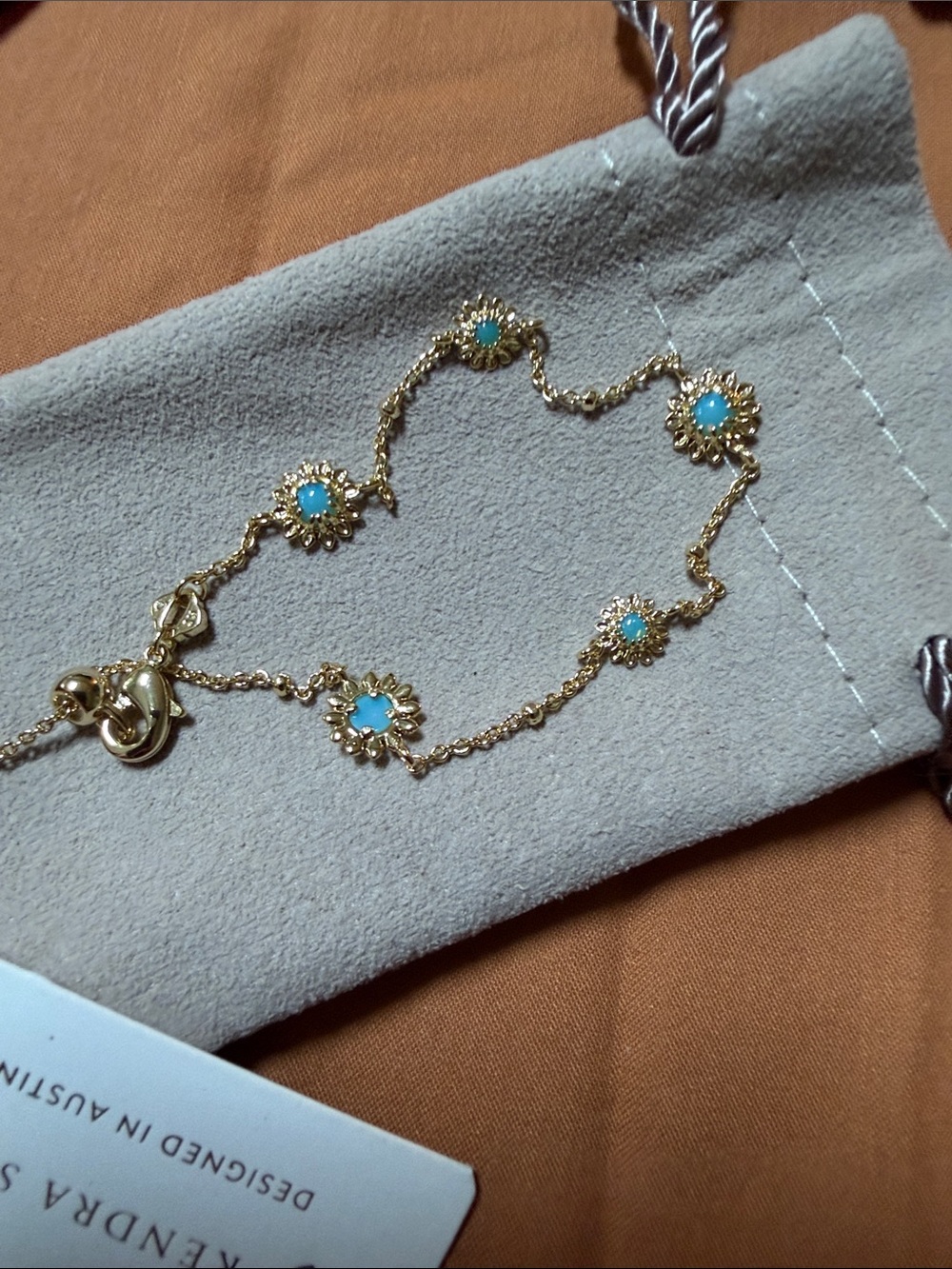 Kendra Scott NWT $44 Gold Bracelet with Turquoise Blue Flower Charms - Picture 2 of 5